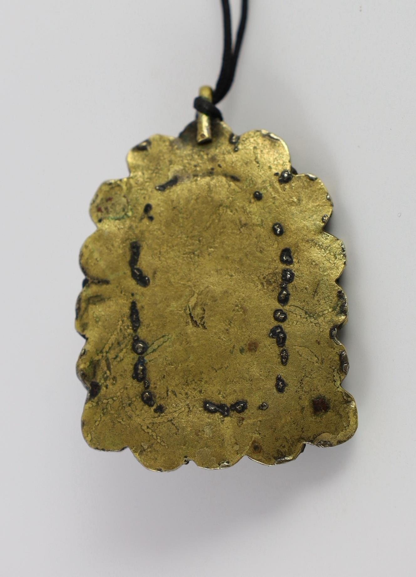 A Tibetan rock crystal and gem set pendant, 19th century, 5.8cm including suspension loop, slight damage
